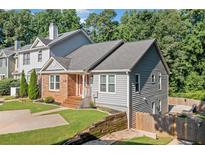 Charming two story home with a combination of brick and vinyl siding, featuring a well maintained front lawn at 1139 Shiloh Nw Ln, Kennesaw, GA 30144