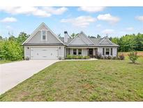 Charming single-Gathering home with a manicured lawn, two-car garage, and inviting curb appeal at 2241 N 16 Hwy, Whitesburg, GA 30185