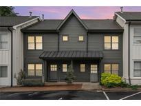 Charming townhome showcasing a newly painted exterior and well-maintained landscaping at 1516 Howell Mill Nw Rd # 16, Atlanta, GA 30318