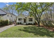 Charming home with a well-maintained lawn, mature trees, and inviting curb appeal at 1833 Flat Shoals Se Rd, Atlanta, GA 30316