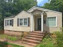 Charming one-story home featuring a covered front porch and symmetrical design at 861 Marion Se Ave, Atlanta, GA 30312