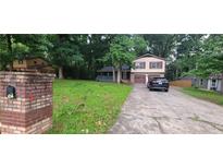 Charming two-story home with a brick mailbox and a long driveway at 2035 Northland Dr, Lawrenceville, GA 30044