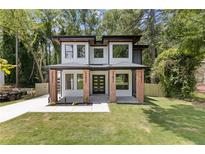 Modern two-story home with brick accents and a well-manicured lawn at 2060 North Avenue Nw, Atlanta, GA 30318