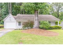 Charming single-story home featuring a well-manicured lawn and attached one car garage at 4307 Windward Ln, Norcross, GA 30093