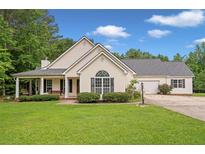 Charming single-Gathering home with inviting front porch and lush green lawn in a quiet neighborhood at 2333 Old Newnan Rd, Carrollton, GA 30116