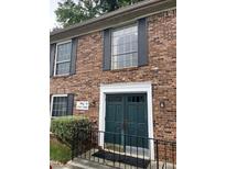 Charming brick building with new paint, offering a welcoming and modern appeal at 5540 Kingsport Ne Dr # 18, Atlanta, GA 30342
