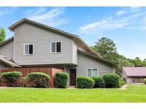 Charming two-story home featuring neat landscaping and a well-maintained lawn at 4908 Willow Lane Ln, Austell, GA 30106