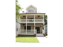 Charming two-story home featuring a double-decker front porch, perfect for enjoying outdoor living at 1062 Lena Nw St, Atlanta, GA 30314