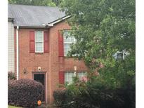 Two-story brick home with red shutters and a well-maintained front yard at 338 Saratoga Pl, Riverdale, GA 30296