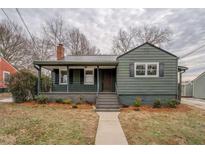 Charming exterior view of a cozy one-story home with a covered porch and well-maintained landscaping at 4131 Carroll St, Covington, GA 30014