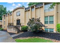 Inviting exterior of the complex with well-maintained landscaping and a classic brick facade at 5400 Roswell Rd # Apt L6, Sandy Springs, GA 30342