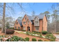 Charming brick home with manicured landscaping and a welcoming entrance in a peaceful setting at 5936 Millstone Ln, Stone Mountain, GA 30087
