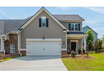 Charming two-story home with a two-car garage, well-manicured lawn and appealing curb appeal at 4583 Grenadine Cir, Acworth, GA 30101