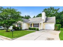 Charming one-story home featuring a well-manicured lawn and inviting curb appeal at 4895 Ozment Ridge Ct, Lithonia, GA 30038