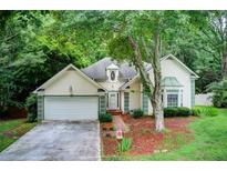 Charming home exterior with lush landscaping and a welcoming facade at 652 Trailwood Sw Ln, Marietta, GA 30064