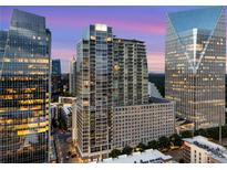 Stunning high-rise condo building with modern architecture and city views at sunset at 3325 Piedmont Rd Ne # 1907, Atlanta, GA 30305
