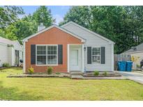 Charming single-story home with brick accent, black shutters, and manicured lawn at 2026 Patterson Park Pl, Lawrenceville, GA 30044