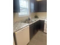 Updated kitchen featuring sleek countertops, modern appliances, and a bright window at 2550 Presidents Walk, Tucker, GA 30084