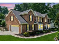 Elegant brick home with a two-car garage and well-manicured landscaping at 742 Maggie Nw Ct, Kennesaw, GA 30144
