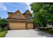 Charming two-story home with a well-manicured lawn and a spacious two-car garage at 4032 Duran Ln, Auburn, GA 30011