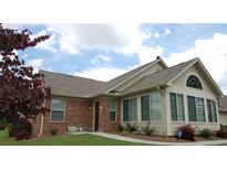 Charming brick and siding home with well-maintained lawn and manicured landscaping at 1000 Silver Summit Se Dr, Conyers, GA 30094