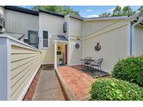 Inviting entrance with a brick patio and seating area, featuring a charming exterior at 764 Patterns Sw Dr, Mableton, GA 30126