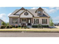 Charming exterior view of a two-story home with stone accents and a landscaped front yard at 413 Horizon Trl, Canton, GA 30114