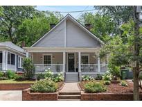 Charming single-Gathering home with a covered front porch and nicely landscaped front yard at 343 Josephine Ne St, Atlanta, GA 30307