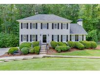 Charming two-story home with a manicured front yard and classic black shutters at 2903 Brookshire Way, Duluth, GA 30096