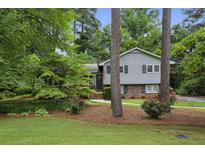 Charming two-story home with well-maintained lawn and landscaping at 687 Monticello Se Way, Marietta, GA 30067