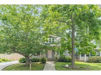 Charming home featuring a welcoming porch and mature trees in a picturesque setting at 3404 Orchard St, Hapeville, GA 30354