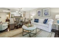 Bright living room featuring a white sofa, stylish decor, and hardwood floors at 3650 Ashford Dunwoody Ne Rd # 1024, Atlanta, GA 30319
