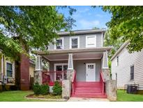 Charming two-story home with a cozy front porch and inviting red steps at 641 Ira Sw St, Atlanta, GA 30312