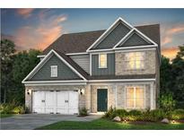 Charming two-story home with a brick facade, a two-car garage, and a landscaped yard at 5268 Mulberry Pass Ct, Hoschton, GA 30548