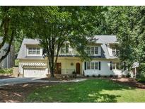 Charming two-story home with a well-manicured lawn and mature trees in a desirable location at 968 Dean Nw Dr, Atlanta, GA 30318