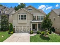 Charming two-story home featuring a well-manicured lawn and a welcoming front porch at 1840 Tululah Trl, Smyrna, GA 30082