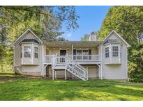 Charming home showcasing a quaint front porch and beautiful bay windows at 6797 Braswell Mountain Rd, Rockmart, GA 30153