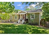 Charming craftsman home featuring an inviting entryway, mature trees, and well manicured lawn at 1734 8Th St, Brookhaven, GA 30341