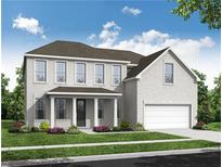 Charming two-story white brick home with a covered front porch and a two-car garage at 6955 Melody Ridge Rd, Buford, GA 30518