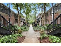 Beautifully landscaped condo community with brick buildings and meticulously maintained grounds at 3675 Peachtree Ne Rd # 24, Atlanta, GA 30319