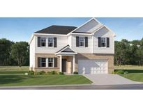 New construction two-story home with brick and white siding and a two-car garage at 229 Paisley Way, Locust Grove, GA 30248