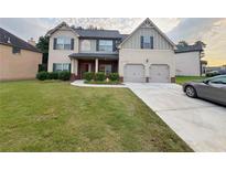 Charming two-story home with a well-manicured lawn and inviting curb appeal at 3429 Lake End Dr, Loganville, GA 30052
