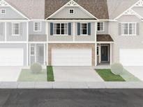Charming two-story home with a brick facade, two-car garage, and a manicured front lawn at 346 Lanier Cir, Woodstock, GA 30189