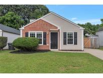 Charming single-story home with brick and siding exterior, well-maintained lawn and simple landscaping at 2022 Patterson Park Dr, Lawrenceville, GA 30044