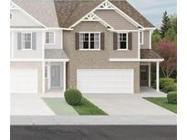 New construction home with brick and siding, paired with a white garage door and charming landscaping at 426 Lanier Cir, Woodstock, GA 30189