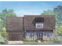 Charming exterior elevation of a single-Gathering home with stone accents, a covered porch, and an attached garage at 5250 Memento Trace, Cumming, GA 30040