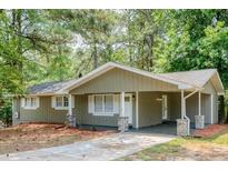 Charming single-story home with a covered carport and a well-maintained front yard at 2279 Hickory Grove Nw Rd, Acworth, GA 30101