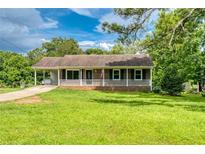 Charming single-story home with a covered porch and well-maintained front yard at 1997 Villa Rica Hwy, Dallas, GA 30157