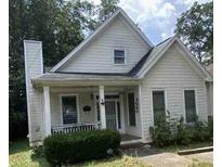 Charming home featuring a cozy front porch, well-kept front yard, and timeless architectural details at 1378 Lucile Sw Ave, Atlanta, GA 30310
