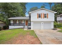Charming two-story home featuring a two-car garage and inviting front porch at 4148 Emerald North Dr, Decatur, GA 30035